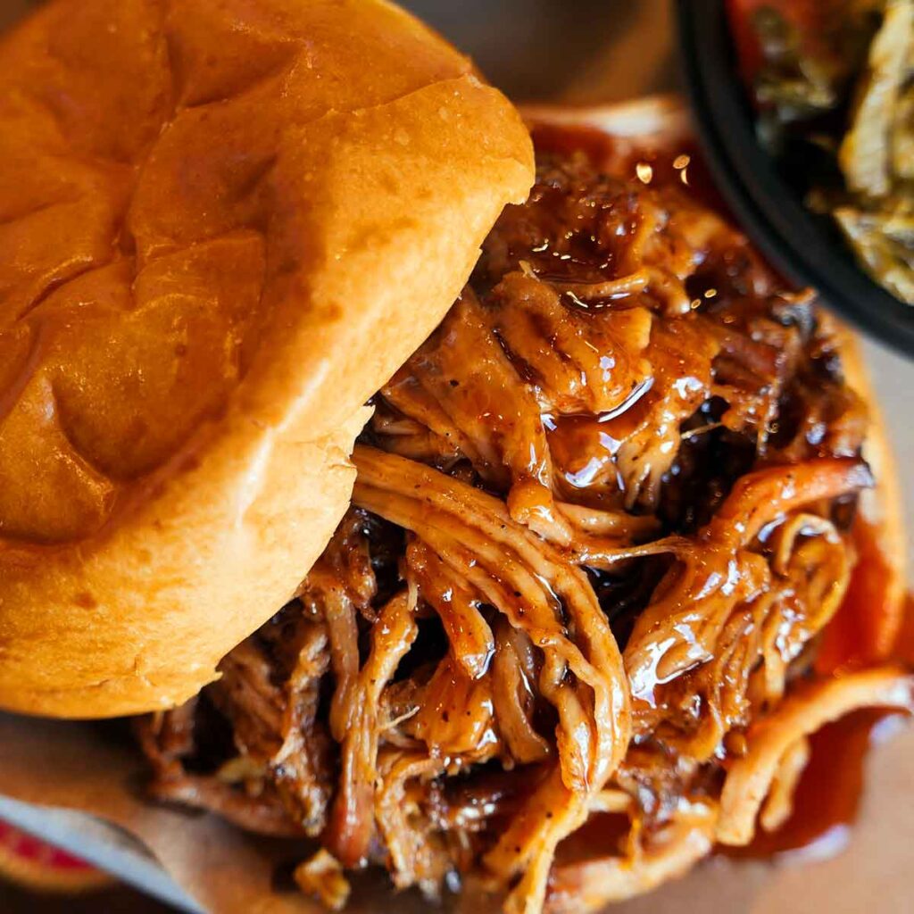 Pulled pork sandwich with sauce.