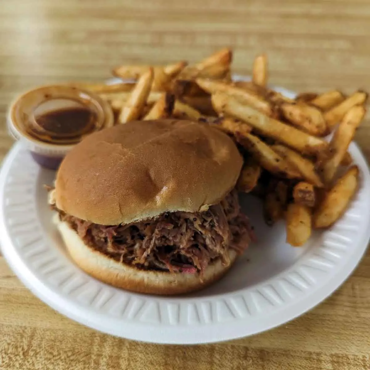 BBQ sandwich with fries.