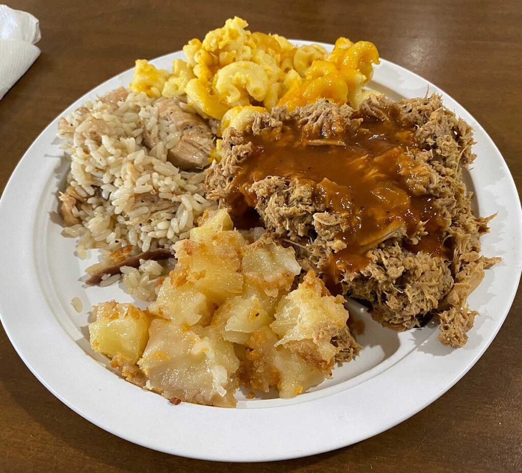 BBQ plate with chicken bog and sides.
