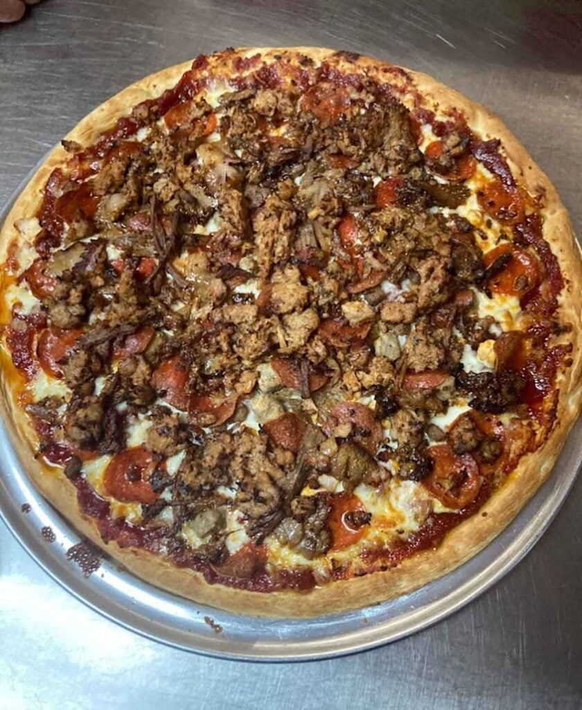 Closeup overhead of pizza by D'z.