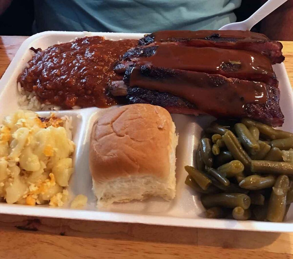 Plate of ribs, hash and sides.