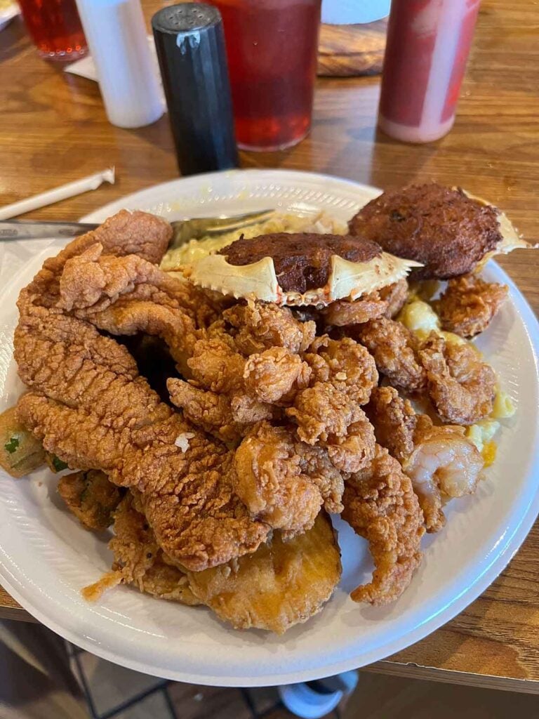 Plate piled high with fried seafood.