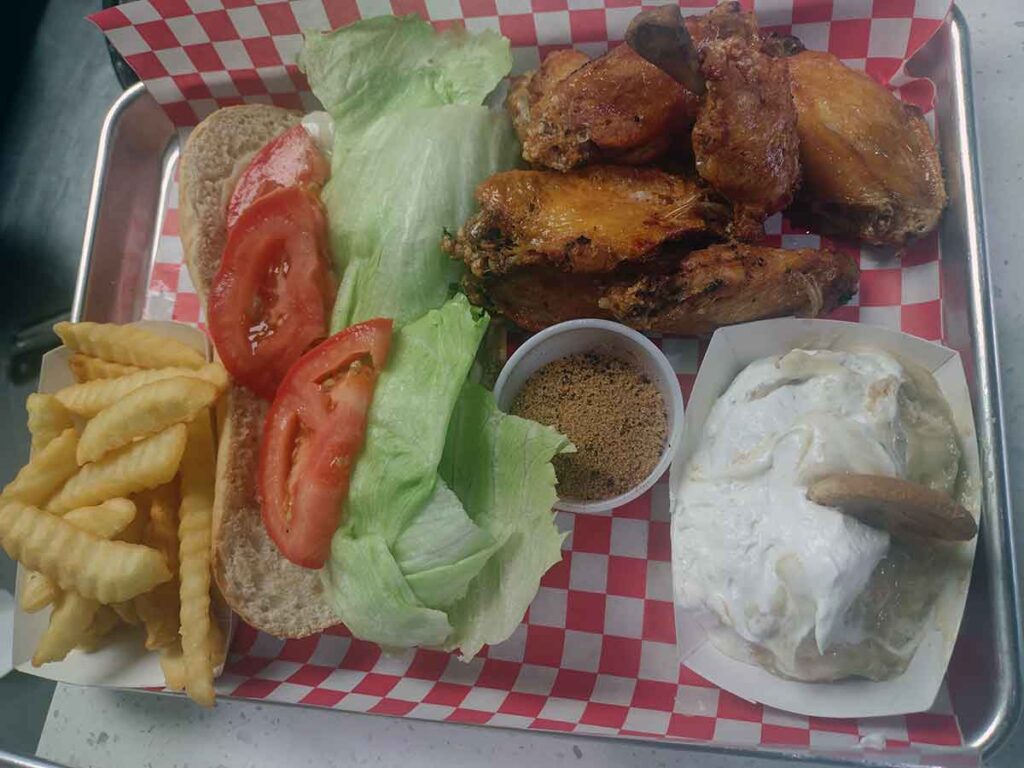 Tray of smoked wings with sides.