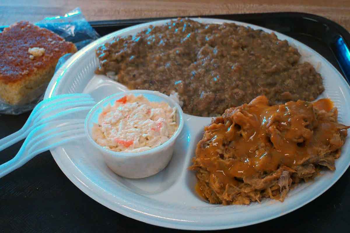 Plate of sauces BBQ, hash, and slaw at Big Ts.