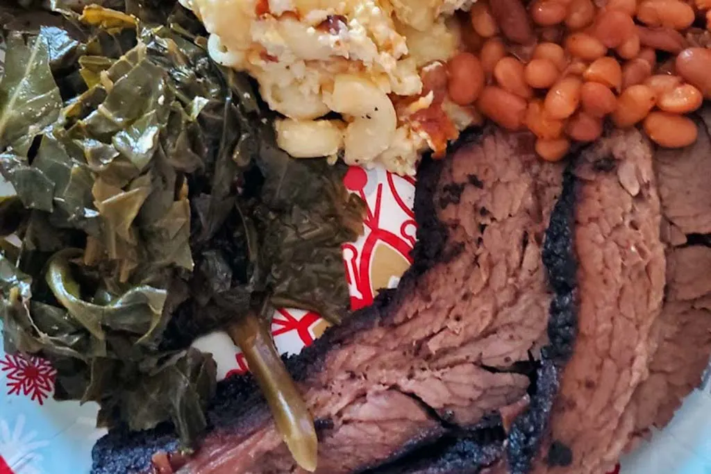 Brisket with three side dishes at Railroad BBQ.