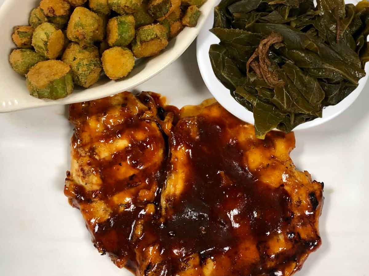 BBQ pork chop with collards and fried okra.