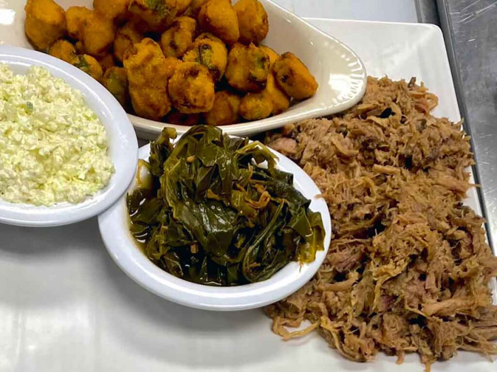 Pulled pork with collards, slaw, and fried okra.