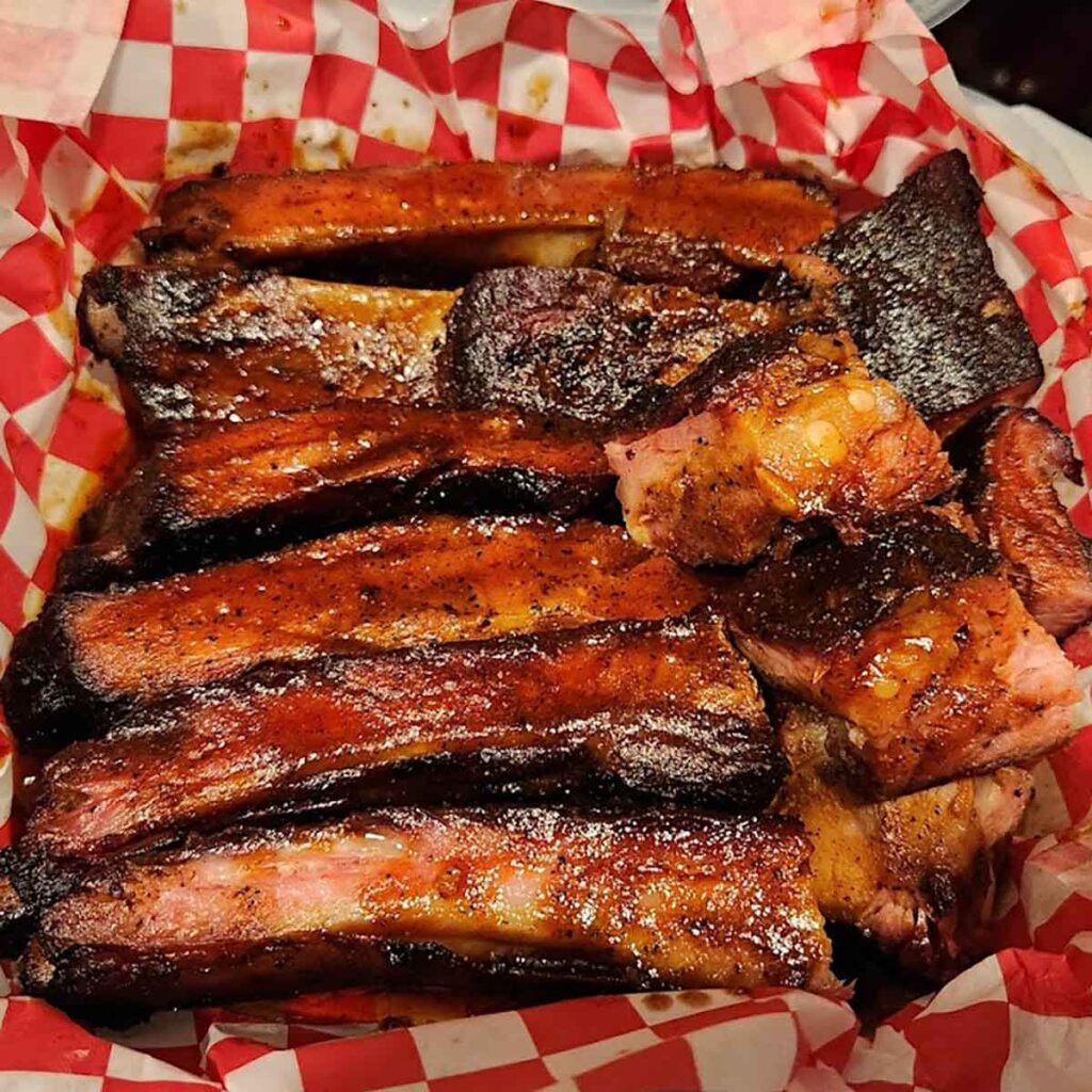 Tray of sauced ribs.