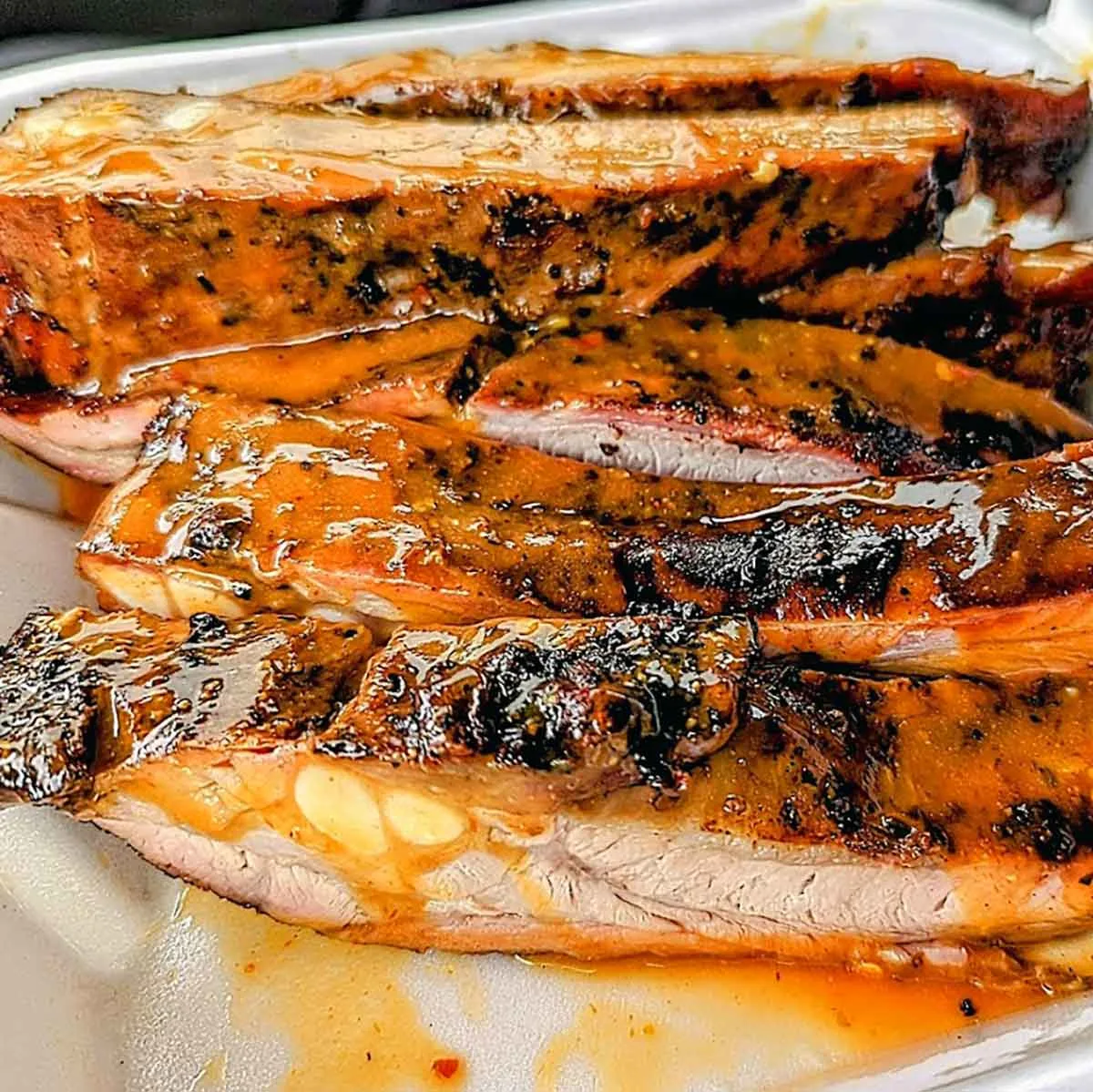 Closeup of sauced ribs.