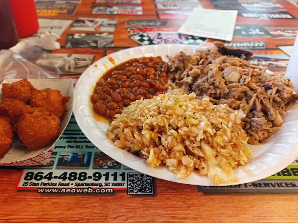 Pulled pork, red slaw, baked beans with hushpuppies.