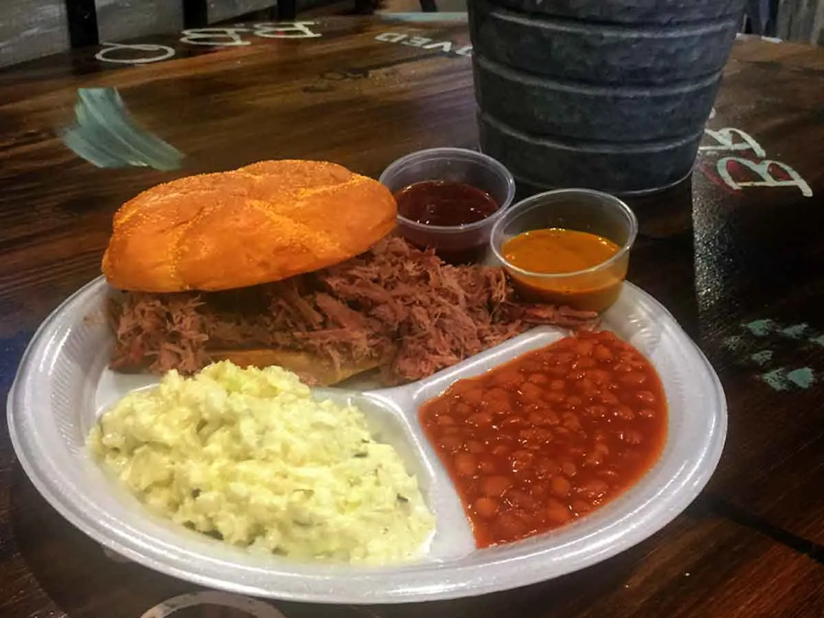 BBQ sandwich with slaw and baked beans.