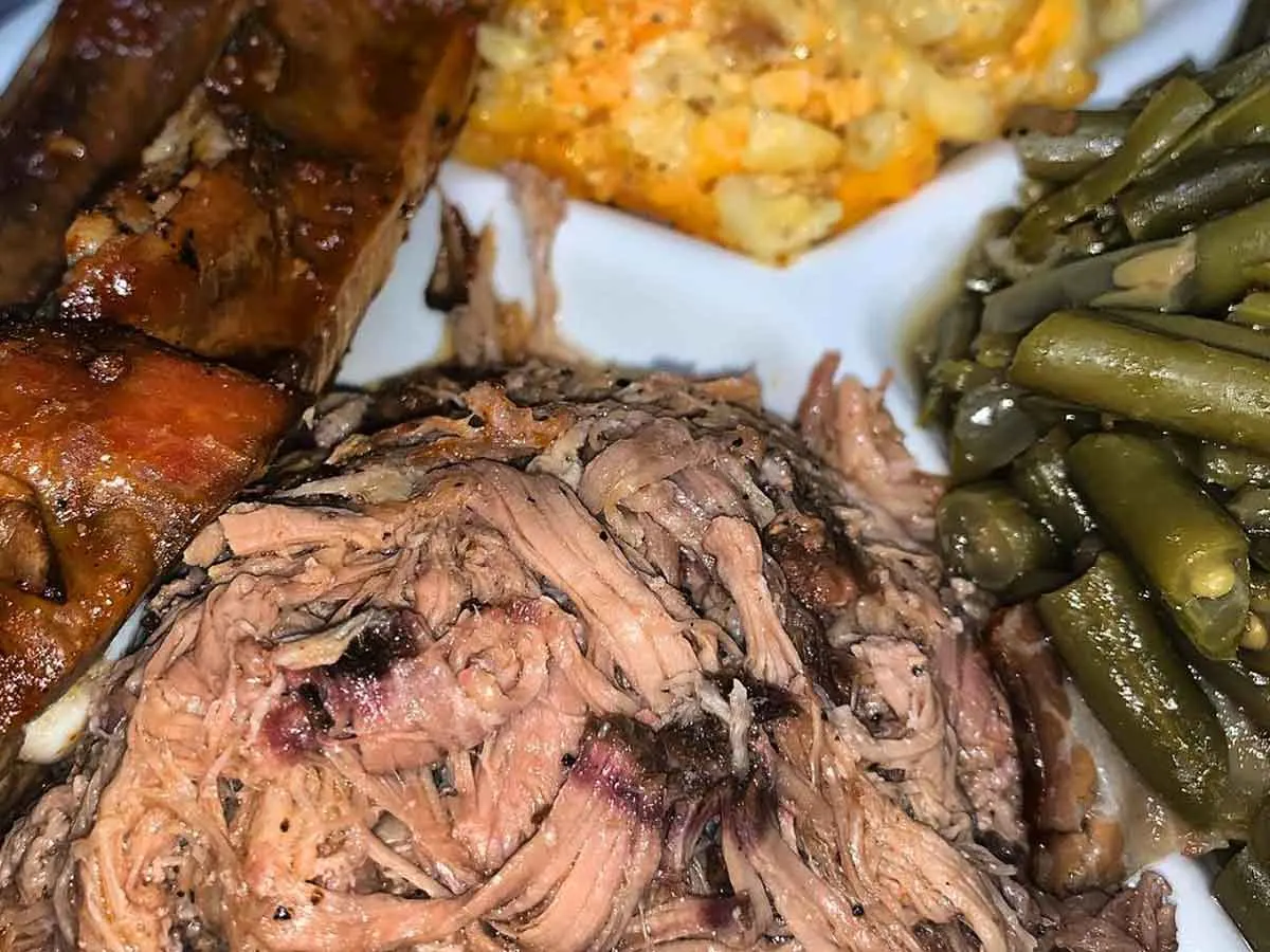 Pulled pork, ribs, with two sides.