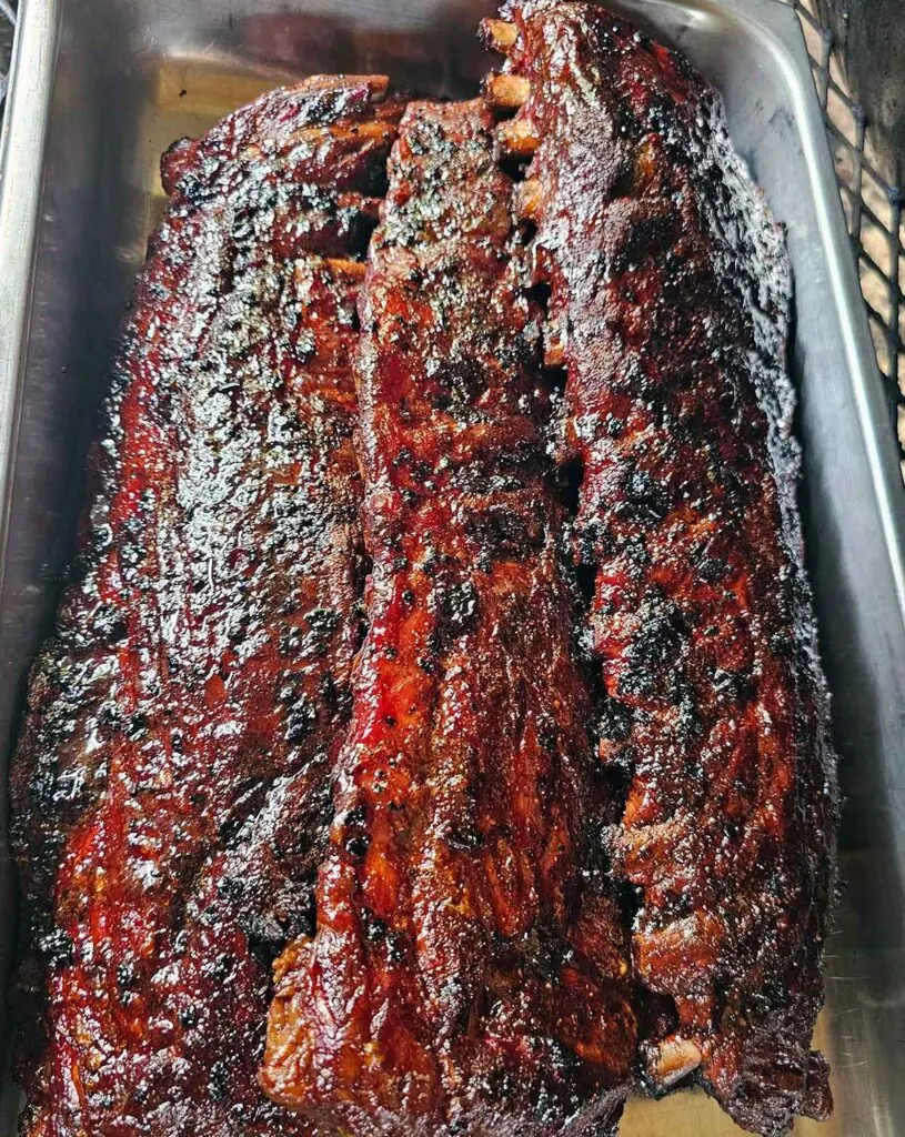 Serving tray with several racks of ribs.