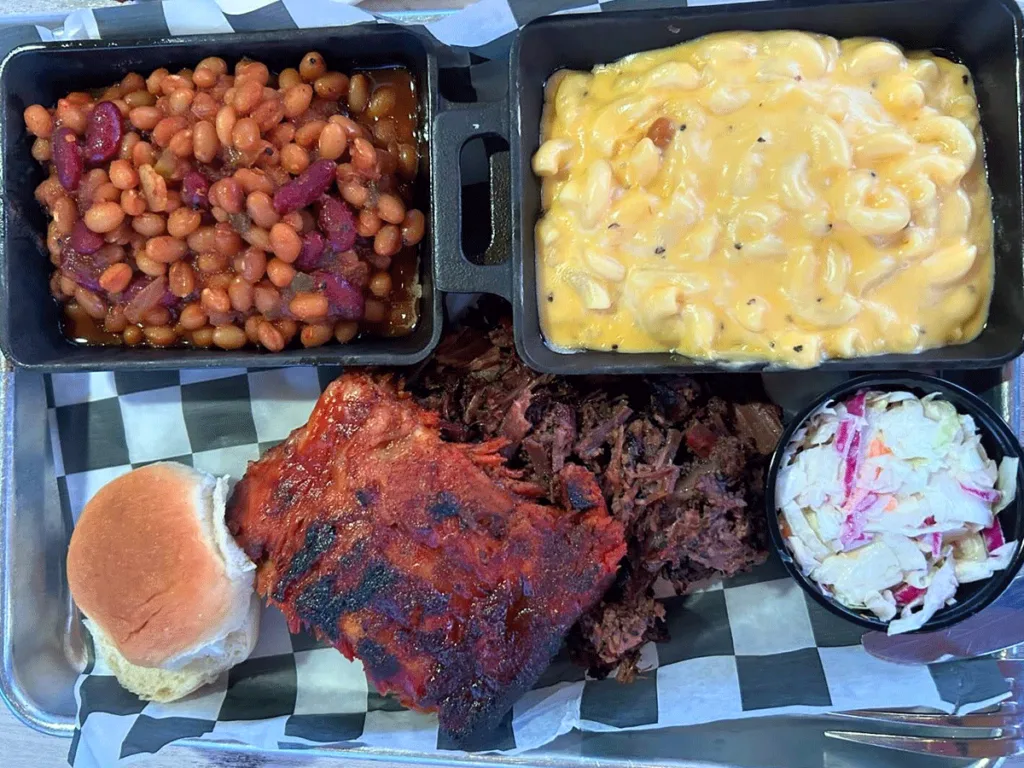 Ribs and pulled pork with sides.