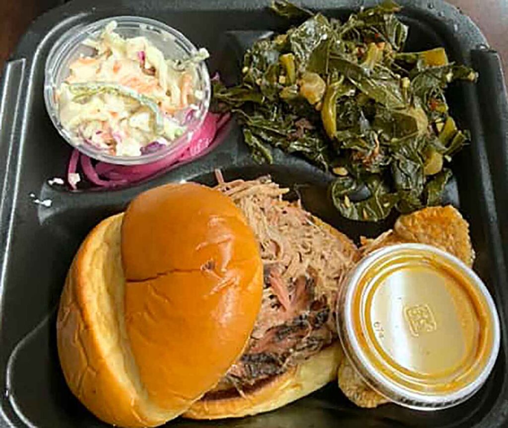 BBQ pork sandwich with slaw and collards.