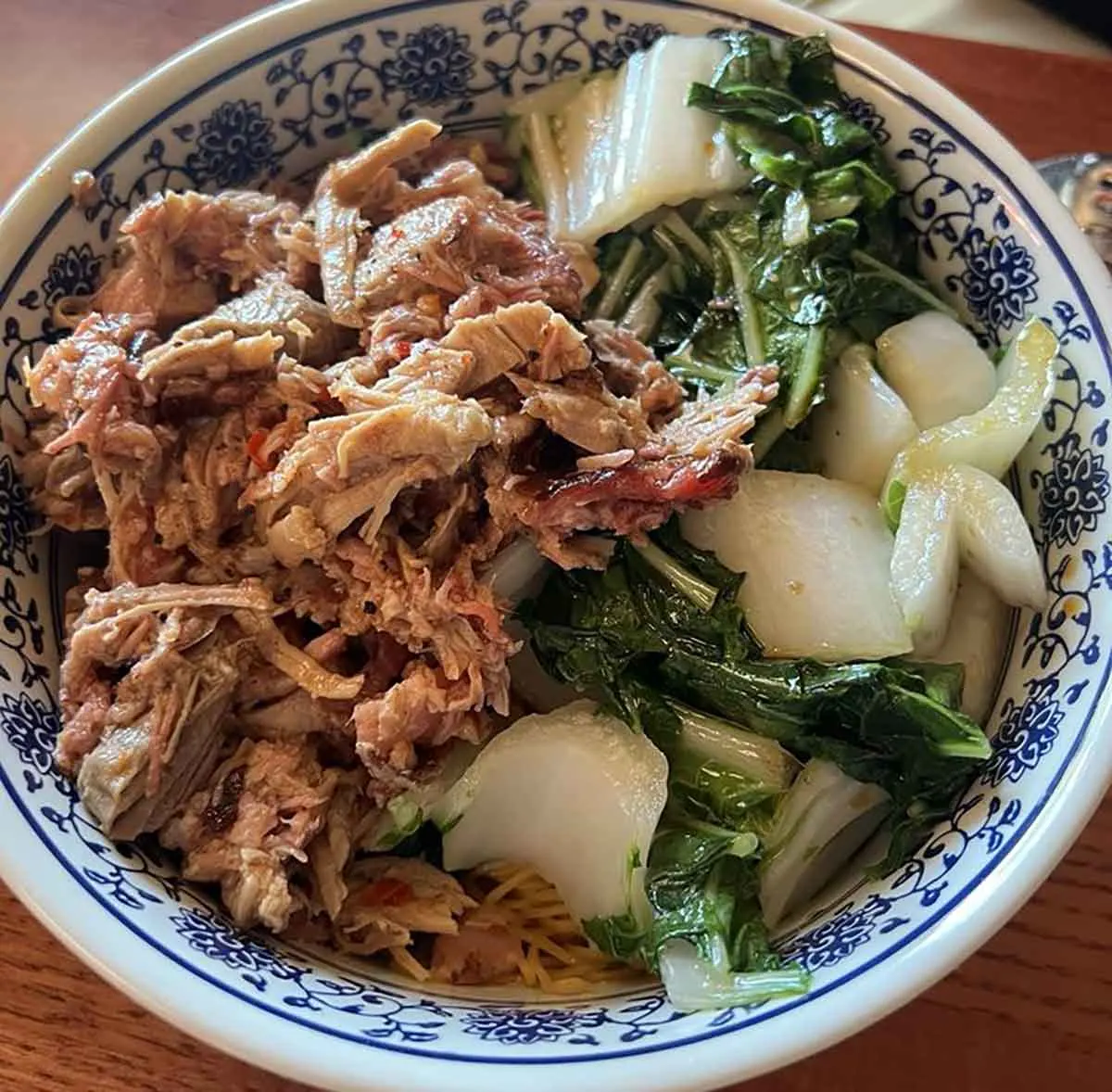 Chopped pork on noodles.