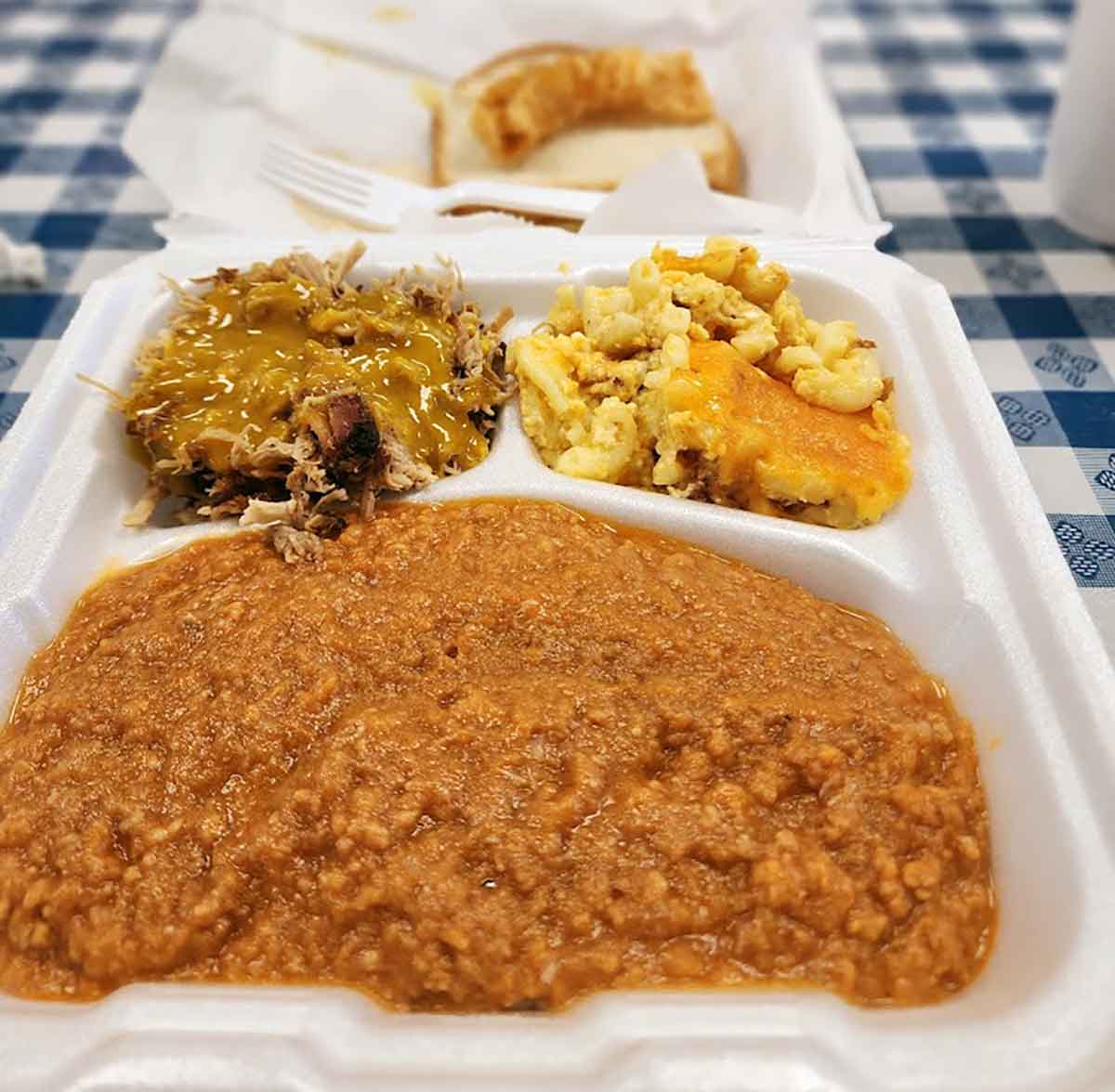Large hash plate with barbecue and Mac & cheese.