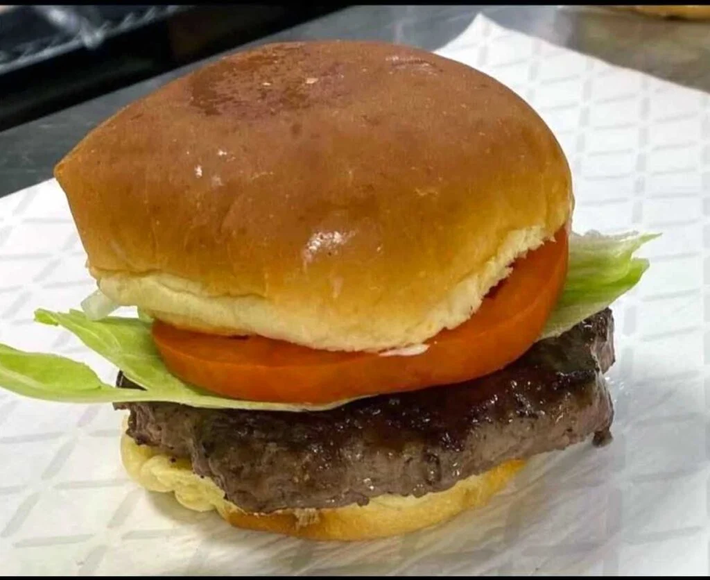 Burger with lettuce and tomato.