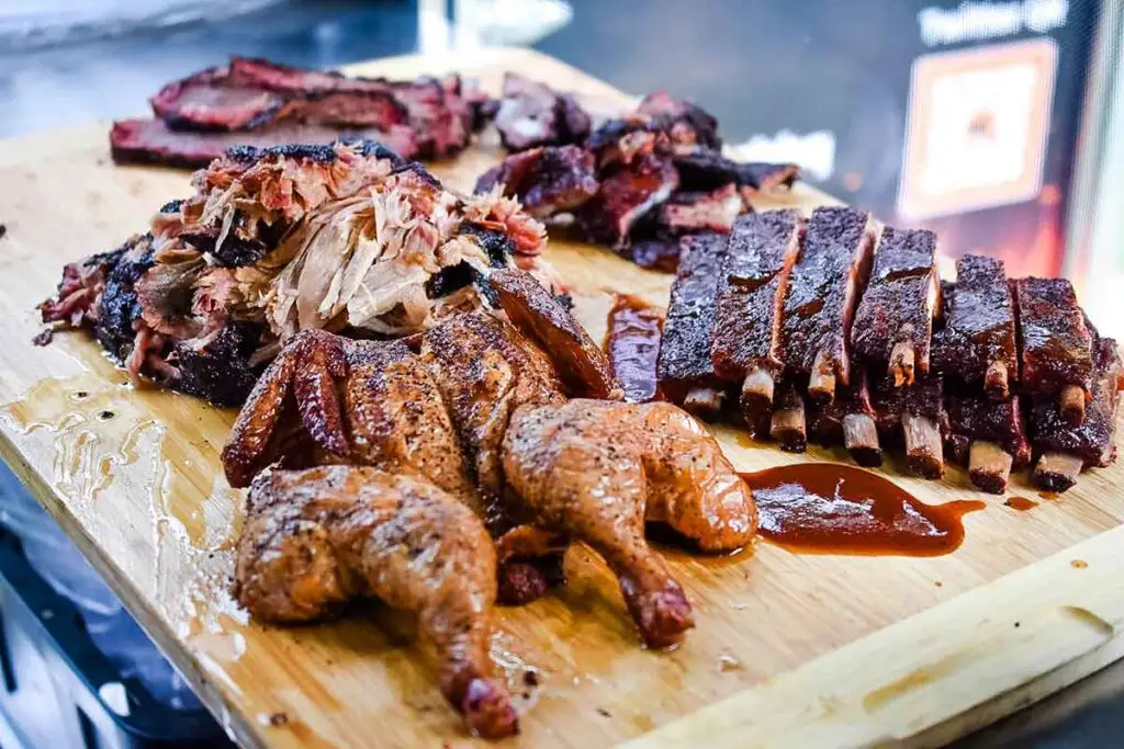 Carving board full of various meats offered by Moohogz.