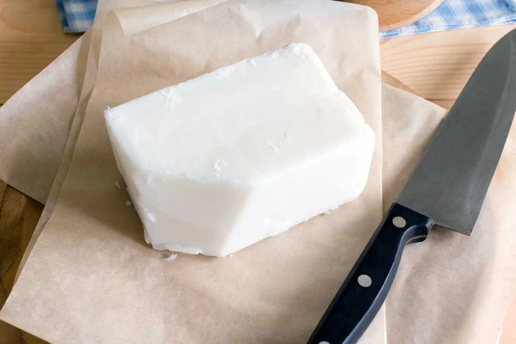 Block of white tallow on butcher paper.