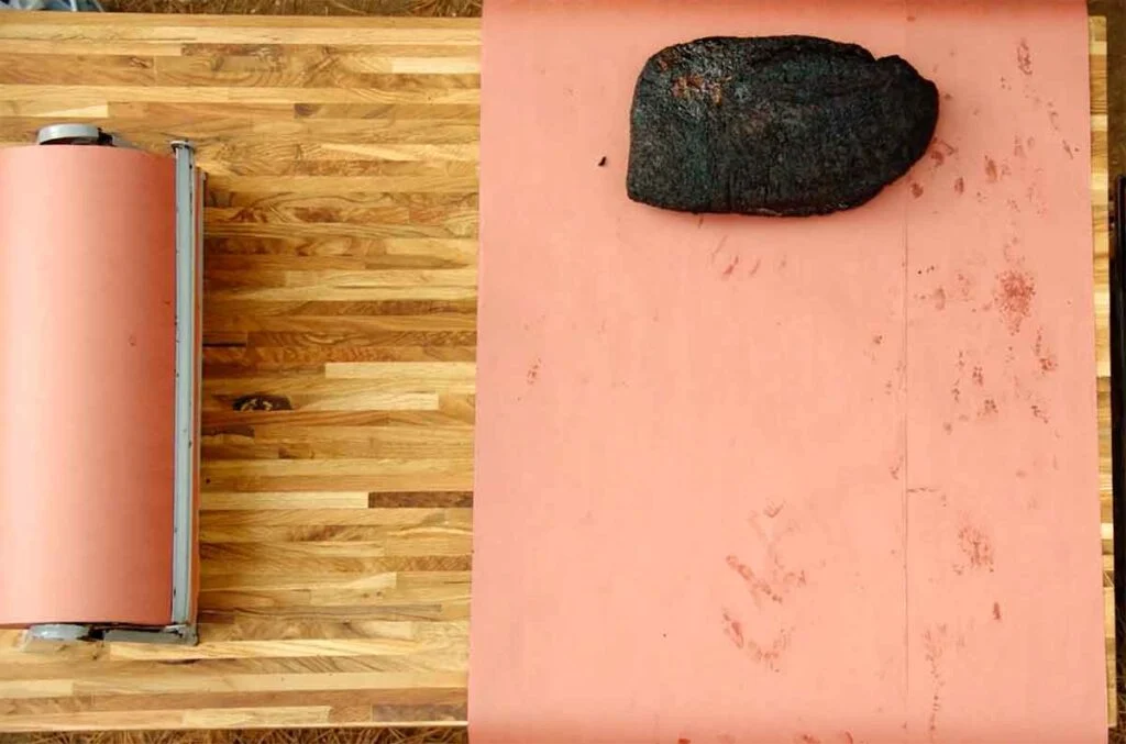 Brisket on two pieces of butcher paper.