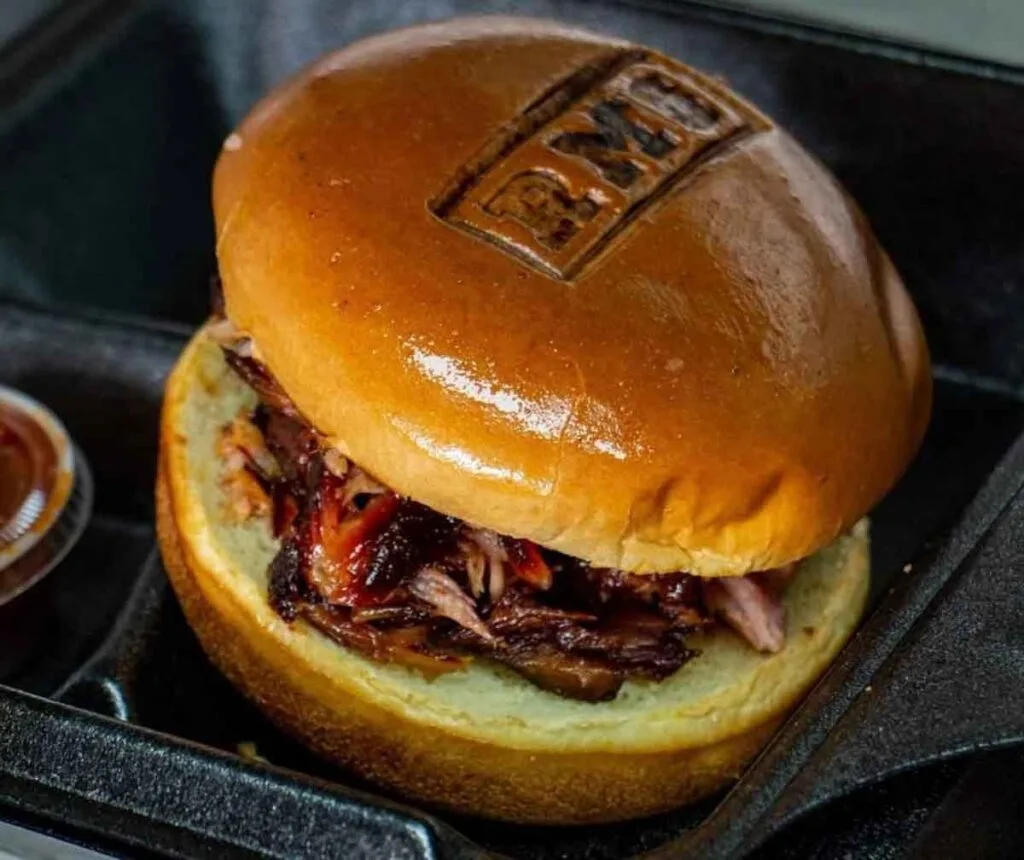 BBQ sandwich with RMS branded in top bun.
