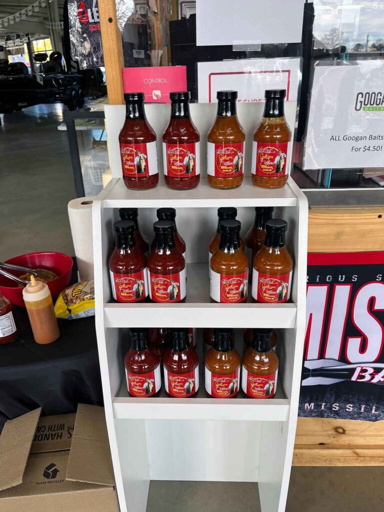 Shelf full of Southern Fusion BBQ sauces.