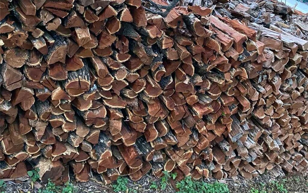 Stacked cord of mesquite firewood.