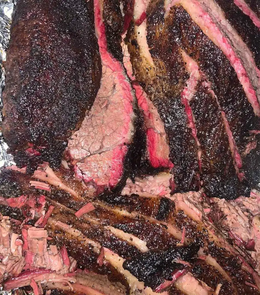 Peach-smoked brisket slices.