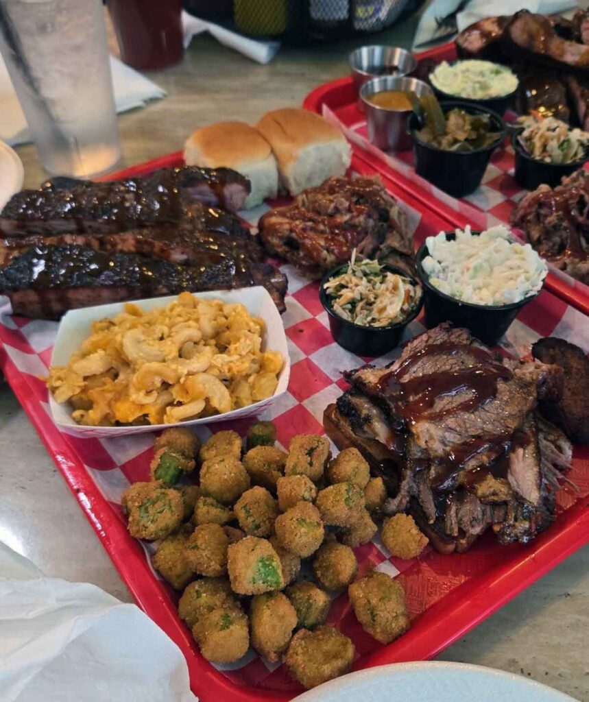 Trays of meats and sides from Hwy 27 BBQ.