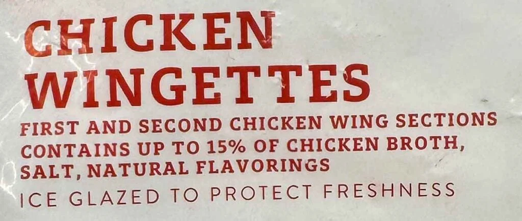 Wingettes label showing &ldquo;contains up to 15%&hellip;solution&rdquo; and &ldquo;ice glazed,&rdquo; indicating added solution plus protective glaze.