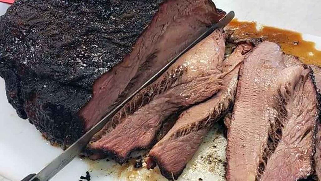 Sliced brisket on cutting board at Big D.