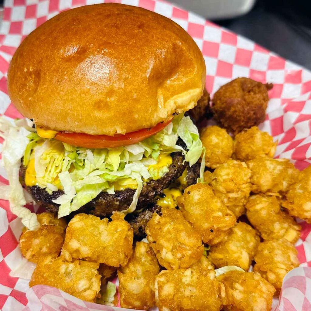Deluxe burger with tater tots.