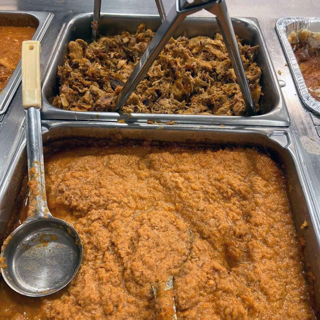 Hash and pulled pork on buffet.