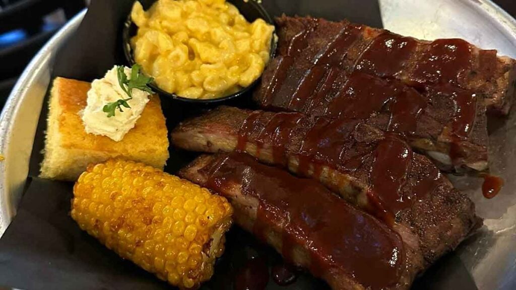 Ribs with corn and mac and cheese.