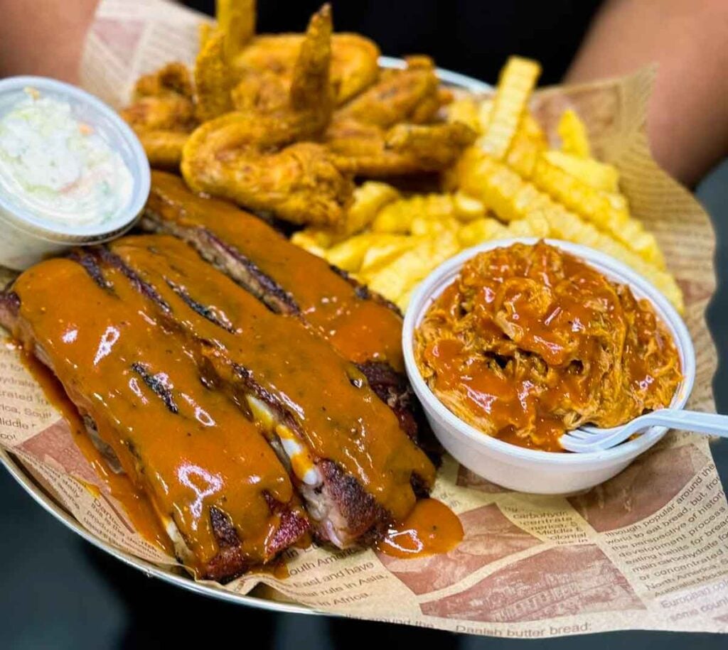 Ribs and pulled pork with sides.