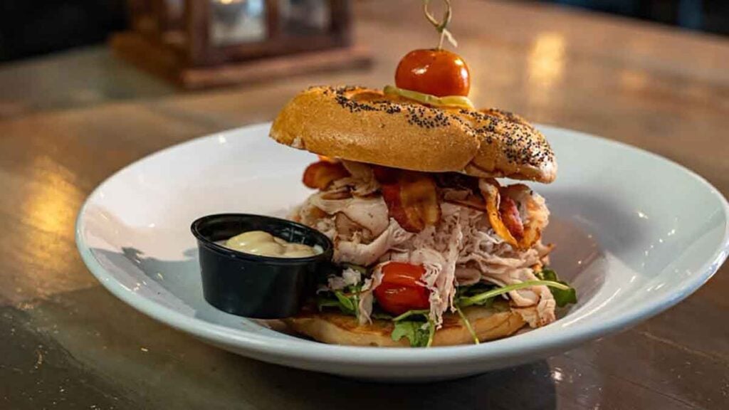 Smoked turkey sandwich with bacon.