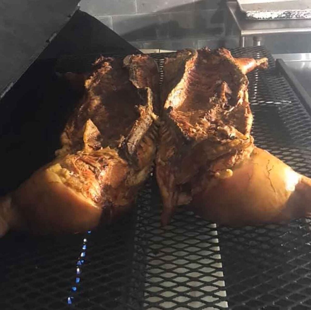 Whole hog on the pit at Fork BBQ in Mayesville.