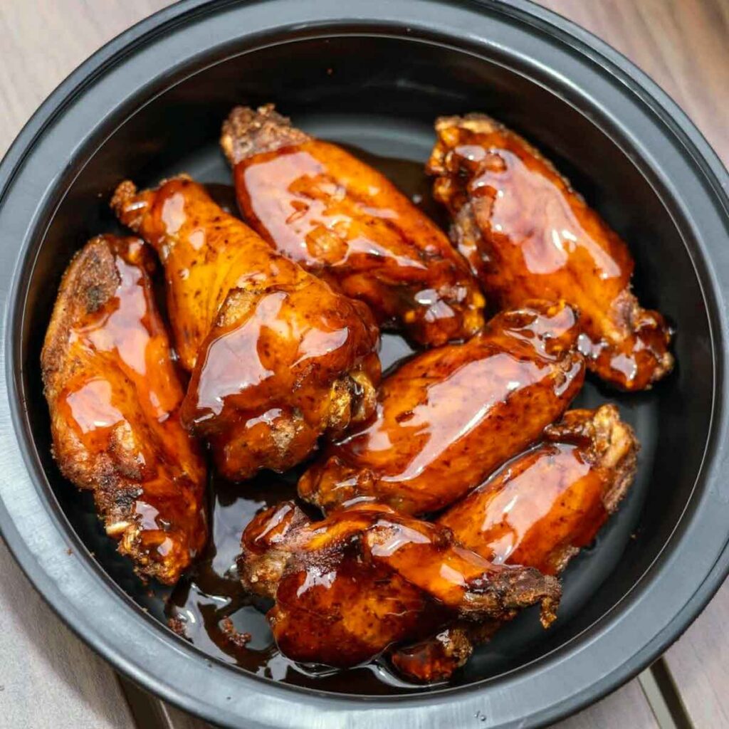 Bowl of sauced wings.