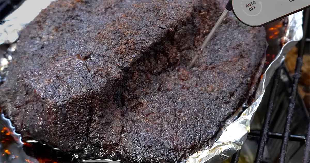 Probe checking the thickest part of a brisket flat for tenderness.
