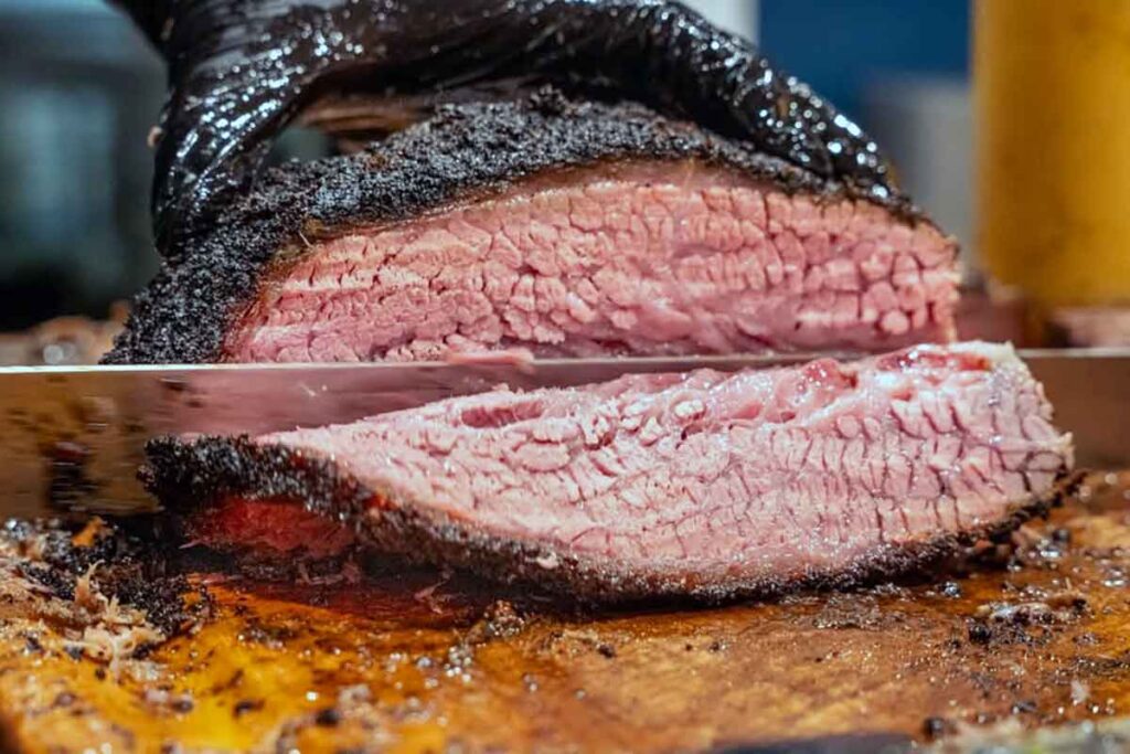 Sliced smoked brisket with dark bark at BearWalrus.