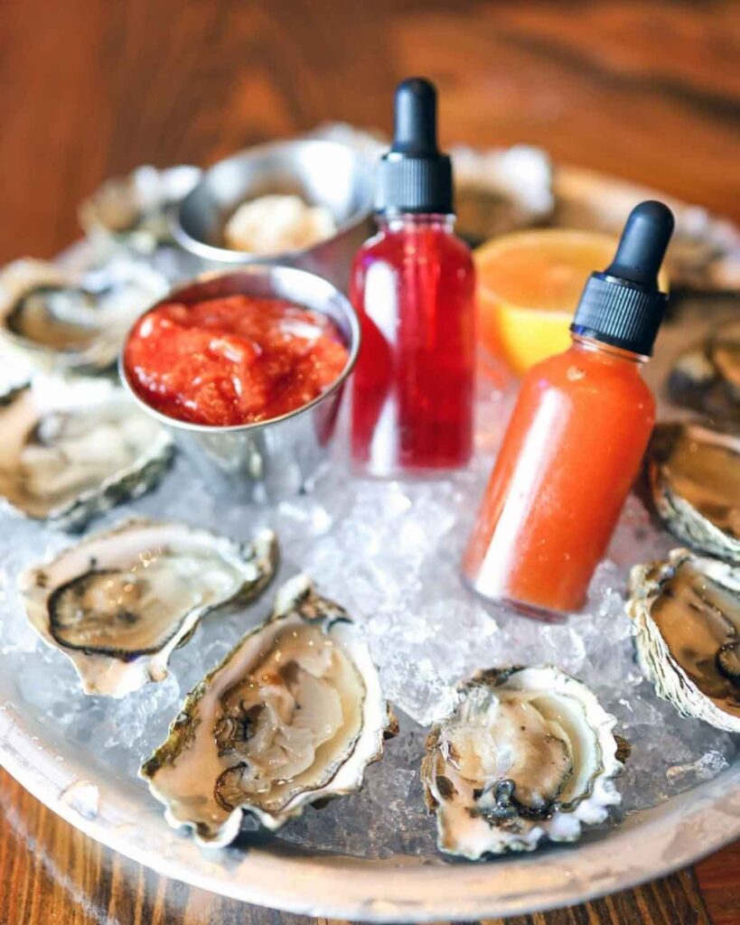 Raw oysters on ice with sauces at BearWalrus.